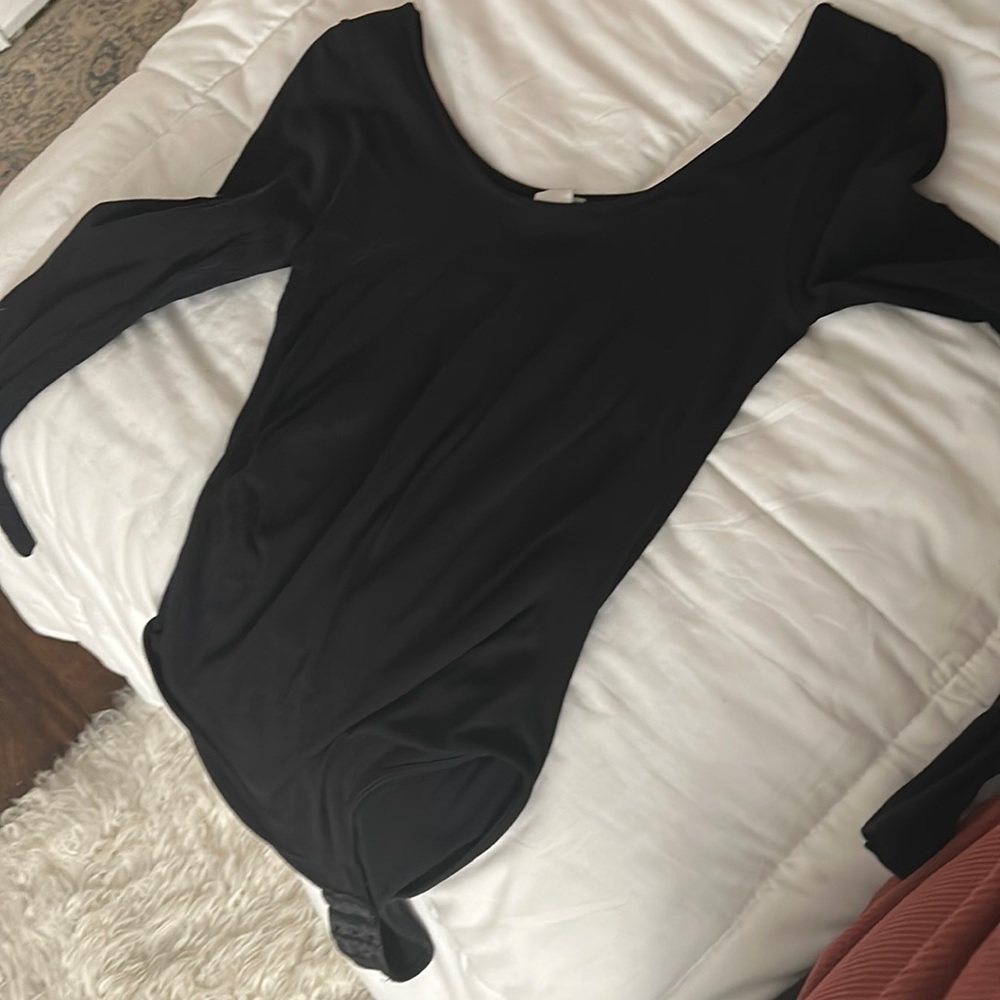 A black onesie long sleeve top..